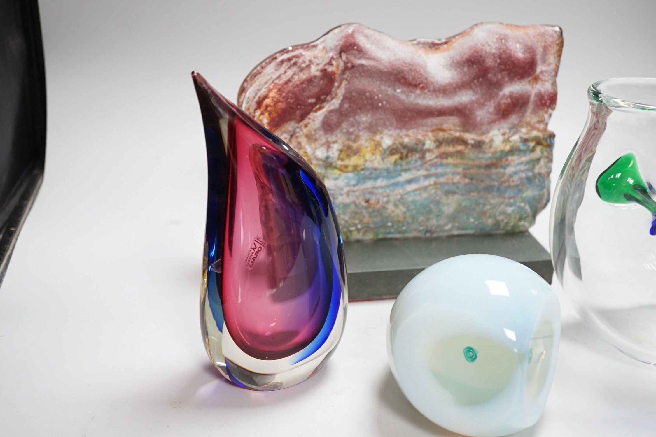 A Murano Oball Vase from Vetreria Artistica, 20cm, a free form green, blue and clear glass vase, 18cm high, an opalescent glass owl paperweight and a slumped glass slab sculpture on stand 25cms wide x 19cms